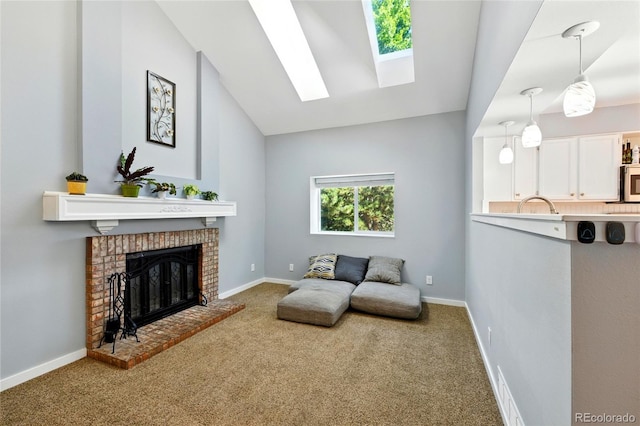 13651 W 65th Ave, Arvada, CO 80004 - living area with carpet, a skylight, lofted ceiling, and a fireplace