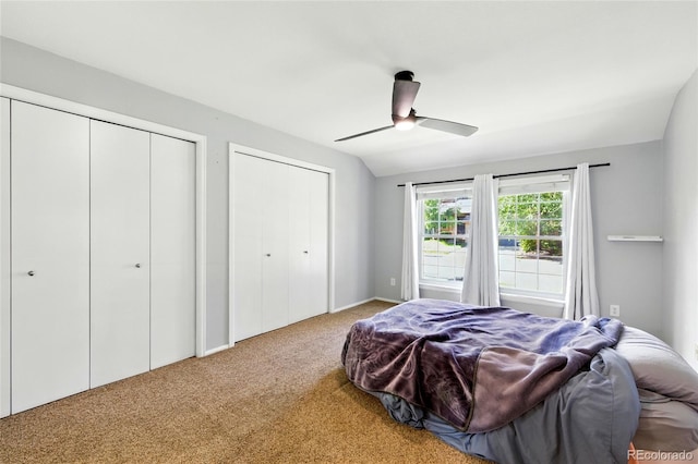 13651 W 65th Ave, Arvada, CO 80004 - carpeted bedroom with two closets, a ceiling fan, and lofted ceiling