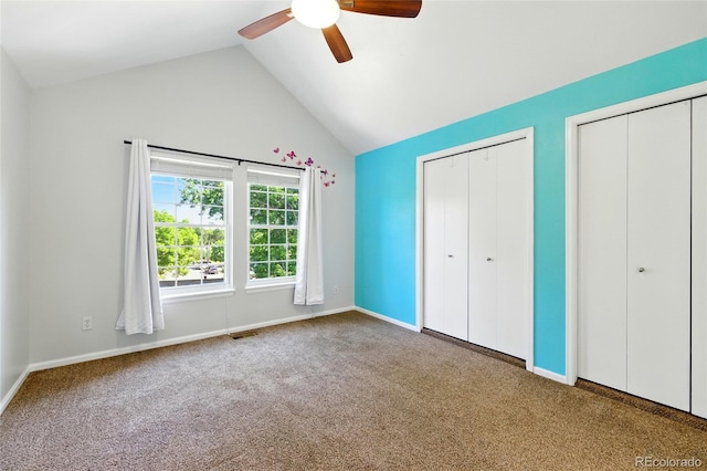 13651 W 65th Ave, Arvada, CO 80004 - unfurnished bedroom with two closets, carpet flooring, ceiling fan, and high vaulted ceiling