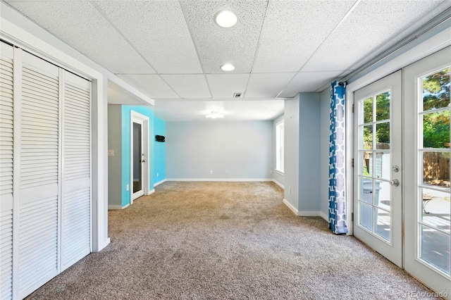 13651 W 65th Ave, Arvada, CO 80004 - basement with carpet flooring, french doors, recessed lighting, and a paneled ceiling