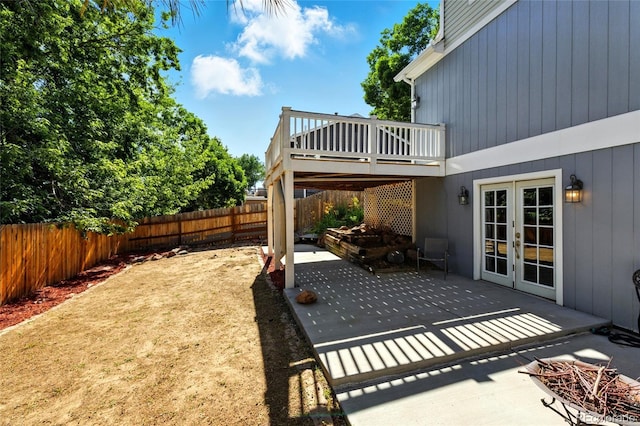 13651 W 65th Ave, Arvada, CO 80004 - fenced backyard with a patio area, a deck, and french doors