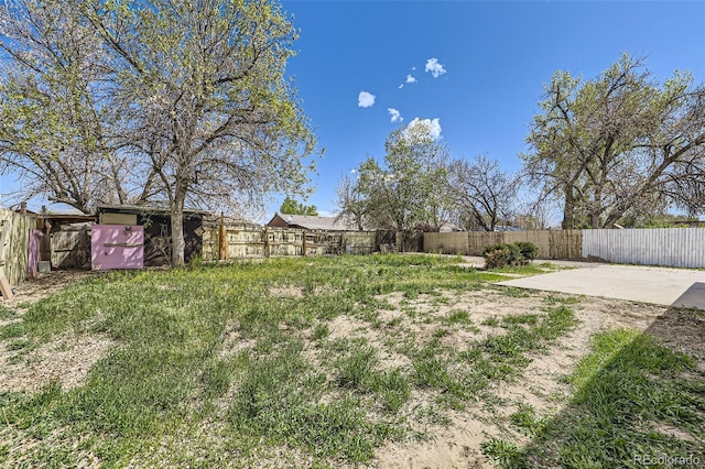 view of yard featuring a patio and a fenced backyard