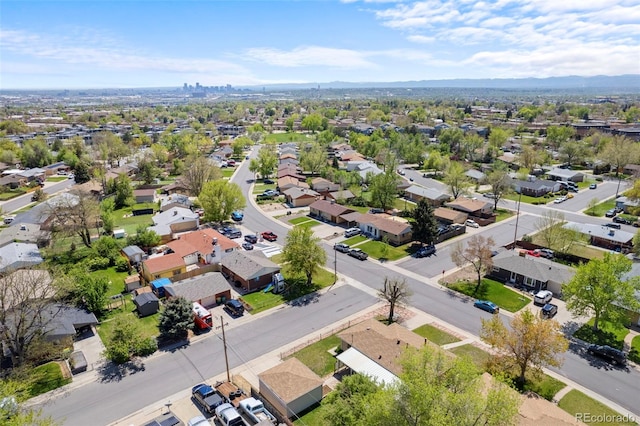 aerial view of residential area featuring a mountain backdrop