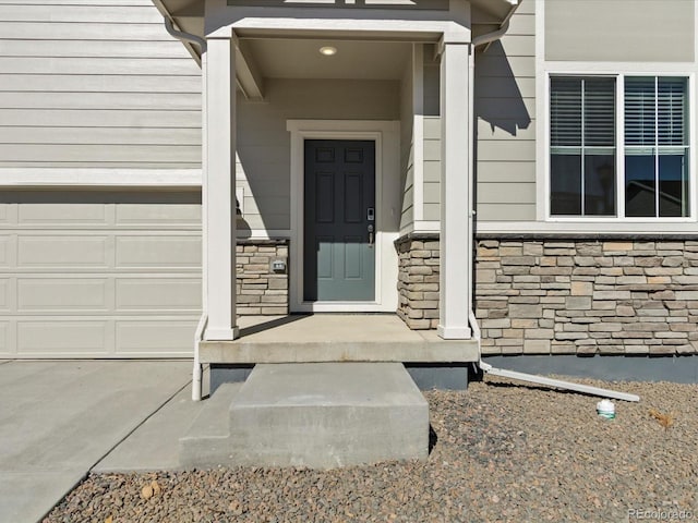 property entrance featuring stone siding