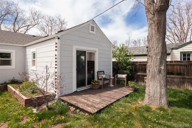 view of outbuilding featuring fence
