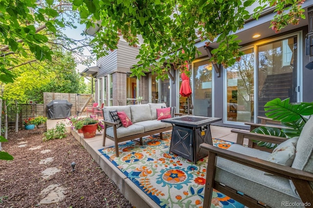 6761 Alan Dr, Denver, CO 80221 - view of patio with an outdoor living space with a fire pit and grilling area