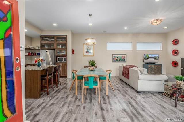 6761 Alan Dr, Denver, CO 80221 - dining space with light wood-type flooring and recessed lighting