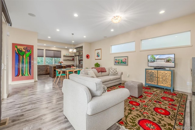 6761 Alan Dr, Denver, CO 80221 - living area featuring wood finished floors and recessed lighting