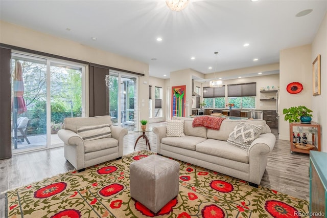 6761 Alan Dr, Denver, CO 80221 - living area with wood finished floors and recessed lighting