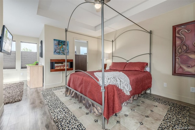 6761 Alan Dr, Denver, CO 80221 - bedroom with a raised ceiling and wood finished floors