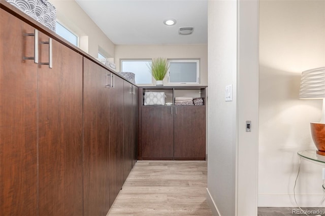 6761 Alan Dr, Denver, CO 80221 - hallway featuring light wood finished floors and baseboards