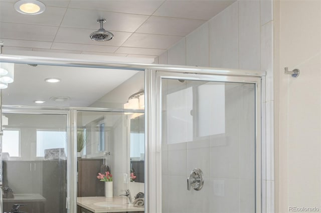 6761 Alan Dr, Denver, CO 80221 - full bath featuring a shower stall, vanity, and recessed lighting