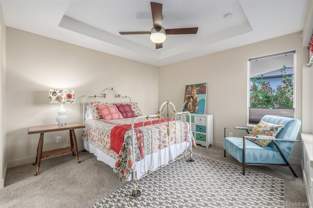 6761 Alan Dr, Denver, CO 80221 - carpeted bedroom featuring a raised ceiling and a ceiling fan