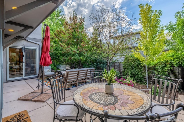 6761 Alan Dr, Denver, CO 80221 - fenced backyard with a patio and outdoor dining area