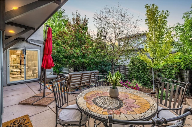 6761 Alan Dr, Denver, CO 80221 - fenced backyard with a patio and outdoor dining space