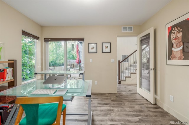 6761 Alan Dr, Denver, CO 80221 - living room featuring stairway and wood finished floors