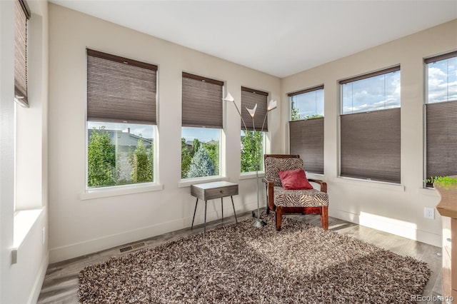6761 Alan Dr, Denver, CO 80221 - sunroom featuring wood finished floors
