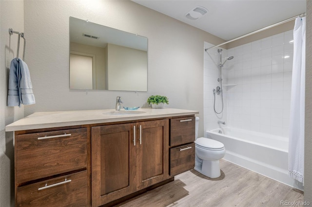 6761 Alan Dr, Denver, CO 80221 - bathroom featuring vanity, wood finished floors, and shower / bath combo with shower curtain