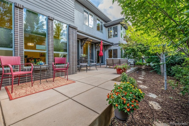 6761 Alan Dr, Denver, CO 80221 - view of patio / terrace featuring an outdoor hangout area
