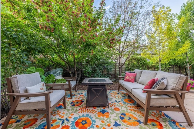 6761 Alan Dr, Denver, CO 80221 - fenced backyard featuring an outdoor living space with a fire pit and a patio area