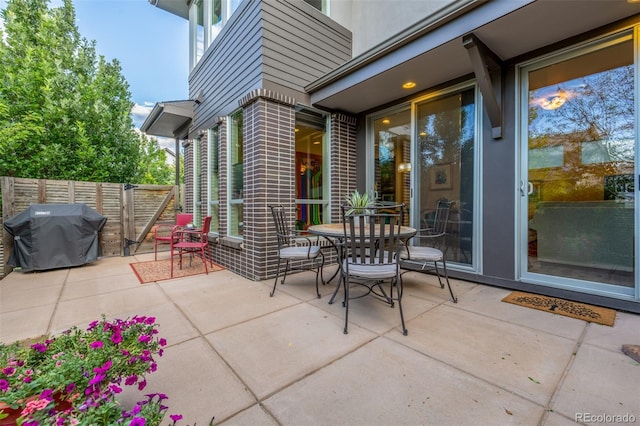 6761 Alan Dr, Denver, CO 80221 - view of patio featuring a grill and outdoor dining space
