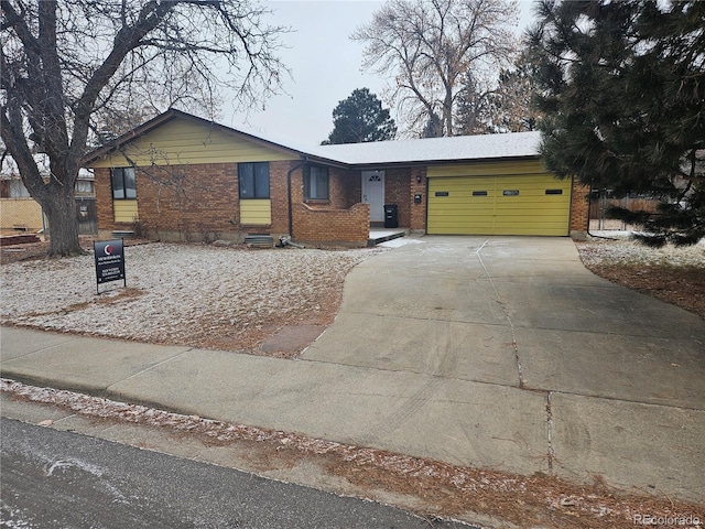 ranch-style house featuring a garage