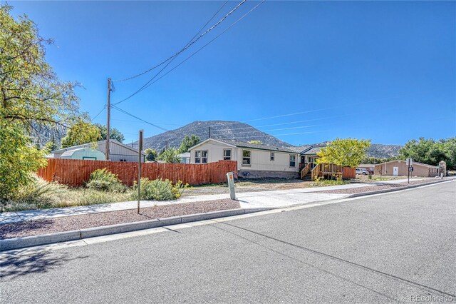 205 Sabeta Ave, Poncha Springs, CO 81242 - view of front of property with fence and a mountain view