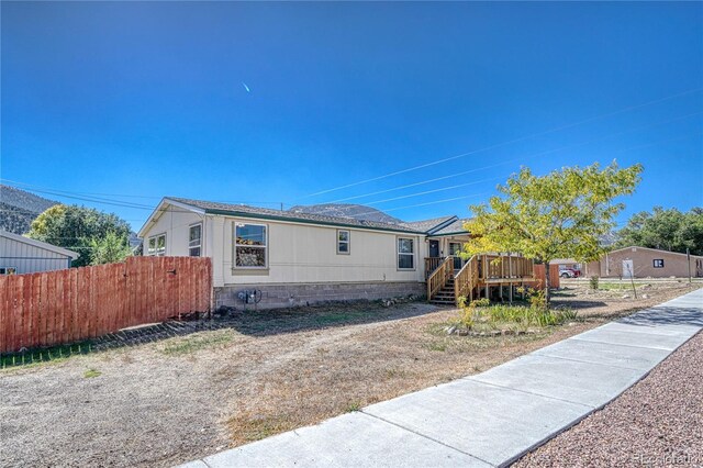 205 Sabeta Ave, Poncha Springs, CO 81242 - view of front of property featuring a wooden deck, fence, and stairway