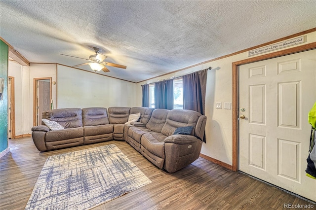 living room featuring a textured ceiling, hardwood / wood-style floors, and ceiling fan