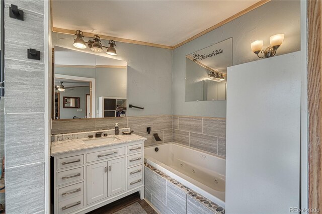 205 Sabeta Ave, Poncha Springs, CO 81242 - full bathroom featuring a jetted tub, a ceiling fan, vanity, and ornamental molding