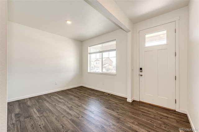13376 Willow St, Thornton, CO 80602 - foyer with healthy amount of natural light and dark wood finished floors