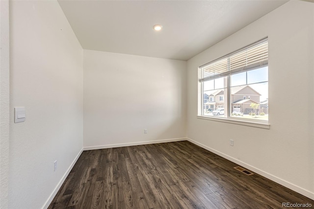 13376 Willow St, Thornton, CO 80602 - empty room with dark wood-style flooring and recessed lighting