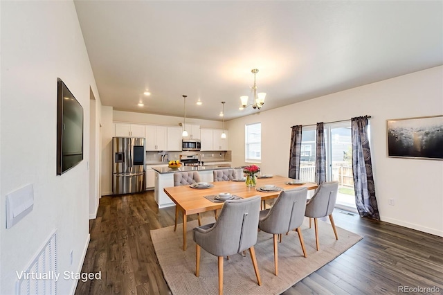 13376 Willow St, Thornton, CO 80602 - dining area featuring a chandelier, dark wood-type flooring, and recessed lighting