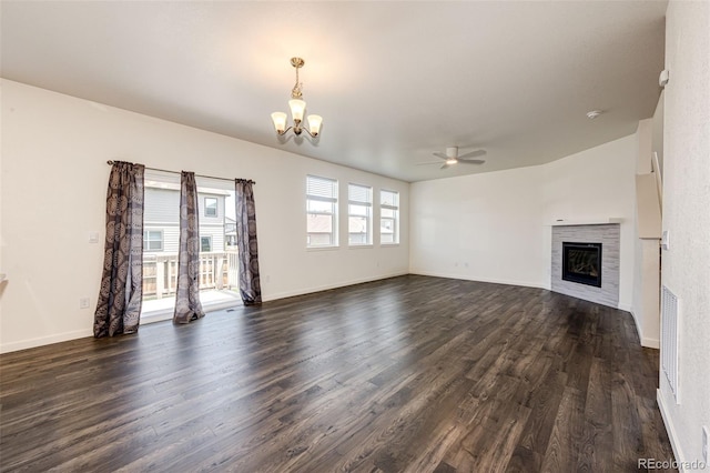 13376 Willow St, Thornton, CO 80602 - unfurnished living room with a chandelier, ceiling fan, dark wood finished floors, and a glass covered fireplace