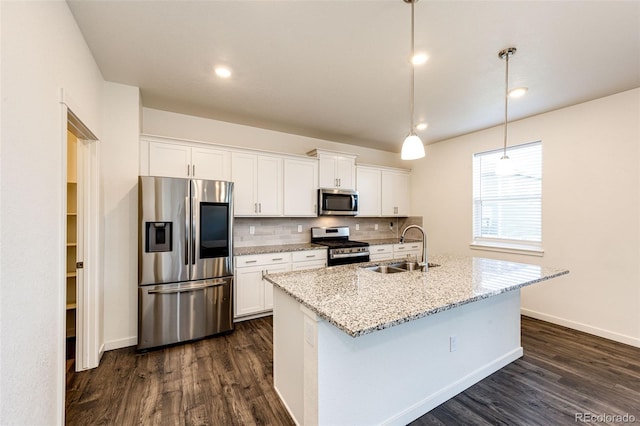 13376 Willow St, Thornton, CO 80602 - kitchen with stainless steel appliances, backsplash, white cabinets, dark wood-type flooring, and recessed lighting