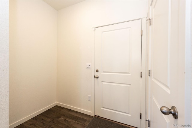 13376 Willow St, Thornton, CO 80602 - doorway featuring dark wood-style floors and baseboards