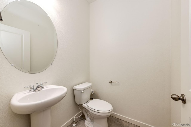 13376 Willow St, Thornton, CO 80602 - half bath featuring baseboards and a sink