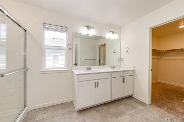 13376 Willow St, Thornton, CO 80602 - full bath with double vanity, tiled shower, and a spacious closet