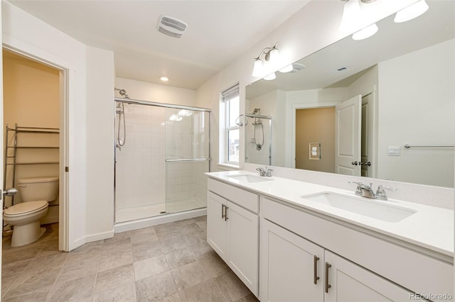 13376 Willow St, Thornton, CO 80602 - bathroom with a shower stall, double vanity, and recessed lighting