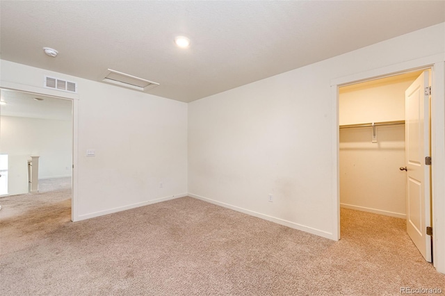 13376 Willow St, Thornton, CO 80602 - unfurnished bedroom featuring carpet floors, a walk in closet, attic access, and a closet