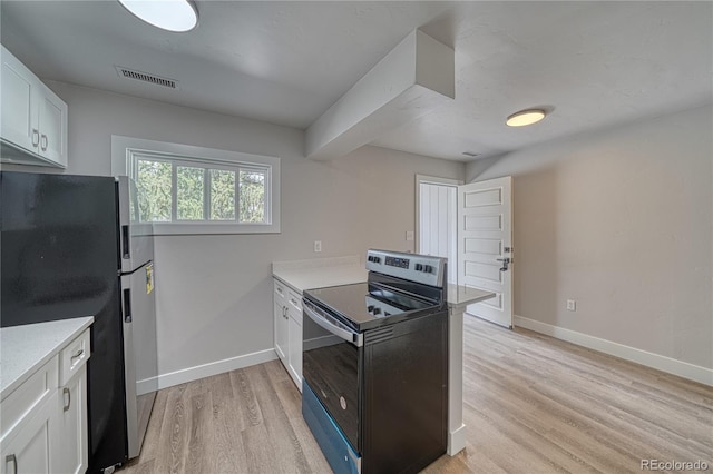 kitchen featuring white cabinetry, stainless steel fridge, light wood-type flooring, and black range with electric cooktop