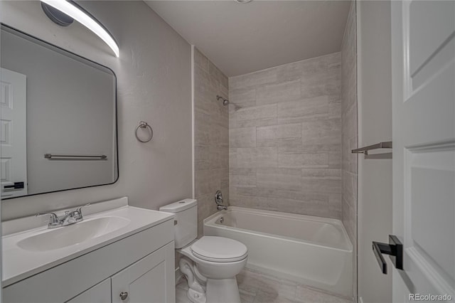 full bathroom with vanity, toilet, and tiled shower / bath