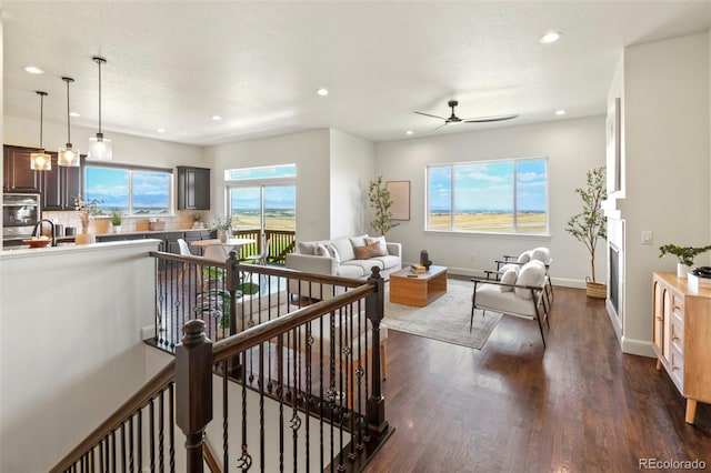 4011 W 149th Ave, Broomfield, CO 80023 - living area with a ceiling fan, recessed lighting, and dark wood-type flooring
