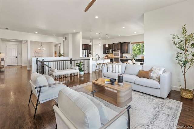 4011 W 149th Ave, Broomfield, CO 80023 - living room featuring a ceiling fan, recessed lighting, and dark wood-type flooring
