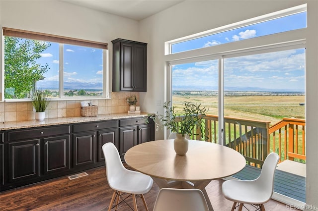 4011 W 149th Ave, Broomfield, CO 80023 - dining area featuring dark wood-style flooring