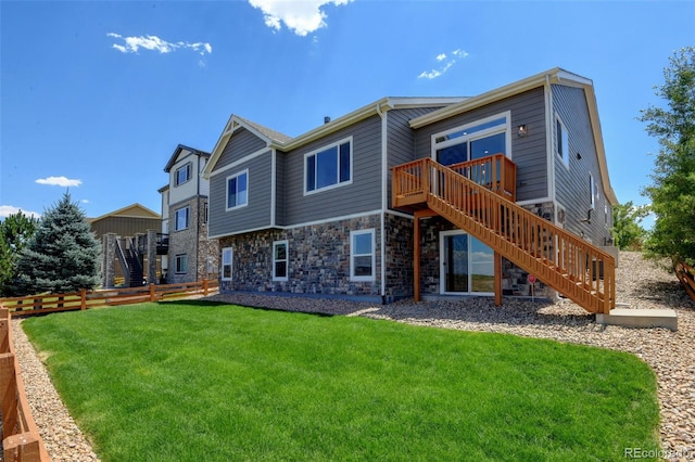 4011 W 149th Ave, Broomfield, CO 80023 - back of house featuring stairway, a deck, and stone siding