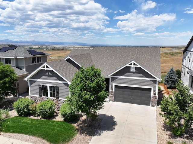 4011 W 149th Ave, Broomfield, CO 80023 - craftsman inspired home featuring stone siding, driveway, a garage, and roof with shingles