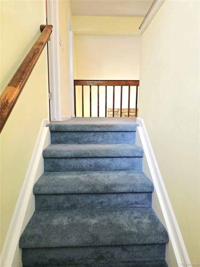 13304 E Asbury Dr, Aurora, CO 80014 - staircase featuring baseboards