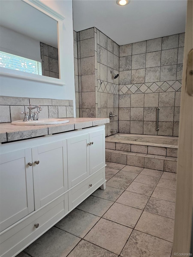 13304 E Asbury Dr, Aurora, CO 80014 - full bathroom with vanity, tile patterned floors, recessed lighting, backsplash, and tiled shower / bath