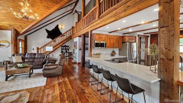 700 Cottage Grove Rd, Alma, CO 80420 - living area featuring lofted ceiling, dark wood-style floors, recessed lighting, wood ceiling, and a chandelier